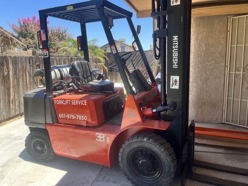 A red 3B's forklift with Forklift Service lettering