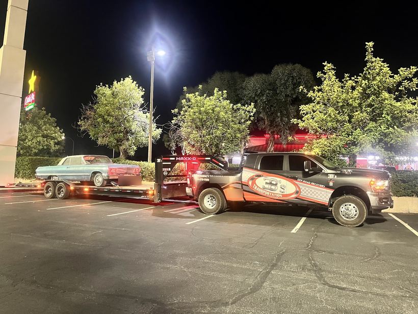 A classic Chevy on the 3B's trailer at night